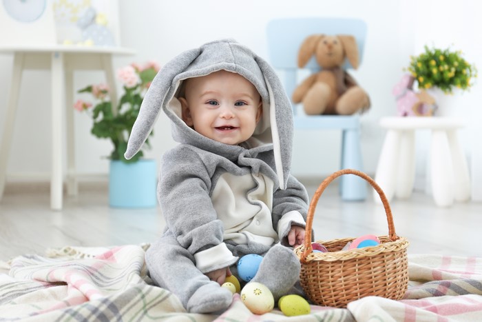 Baby in Easter Bunny Costume with Eggs