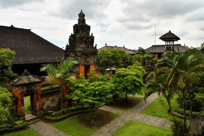 Balinese temple complex with lush greenery and traditional architecture