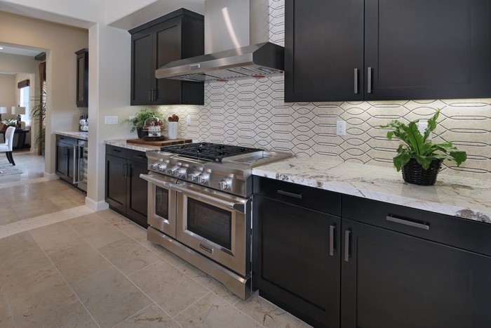 Modern Kitchen with Dark Cabinets and Stainless Steel Appliances