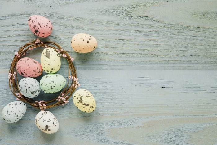 Easter Eggs in a Nest on Wooden Background