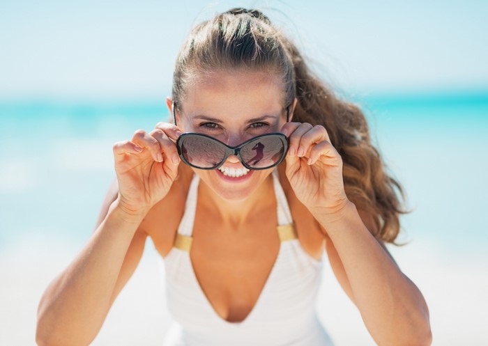 Woman in sunglasses at the beach