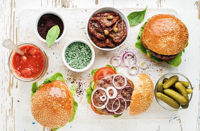 Hamburger ingredients with pickles and sauces