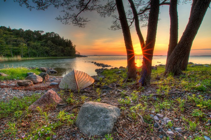 Boat on shore at sunset near Hanko, Finland