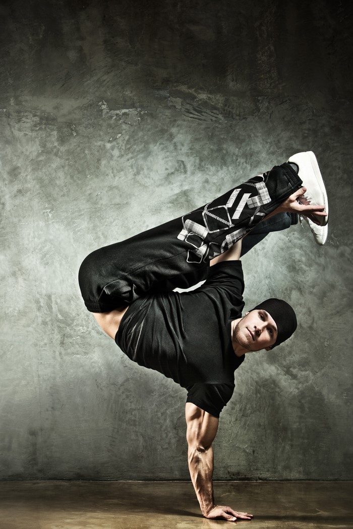 Man breakdancing on one hand