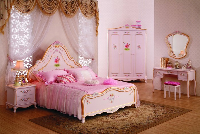 Children's bedroom with pink furniture and floral accents