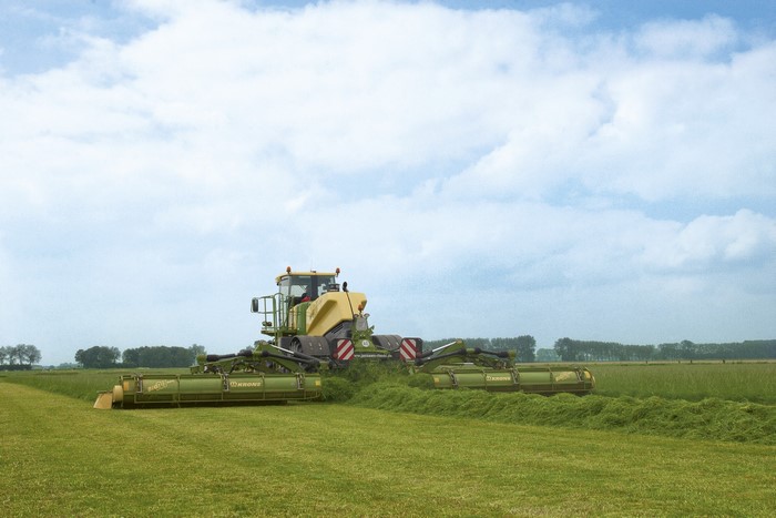 Krone BiG M 500 agricultural machine harvesting a field
