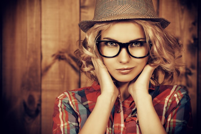 Blonde girl with glasses and hat