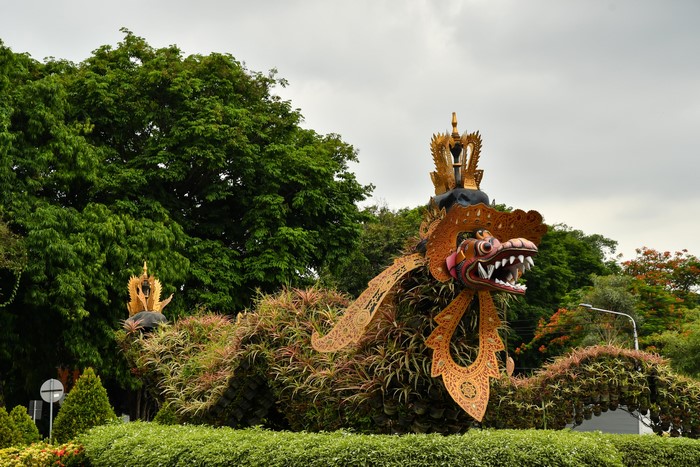 Dragon sculpture covered in plants in Bali, Indonesia