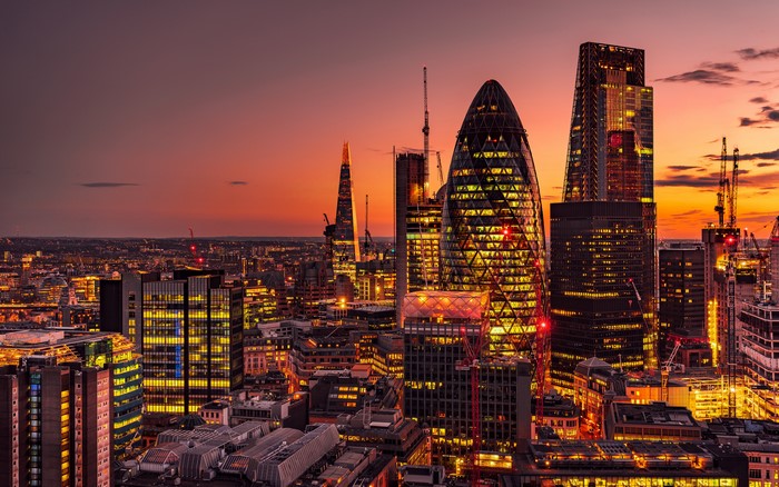 London skyline with Gherkin building at sunset