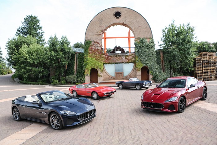 Maserati cars in front of a building
