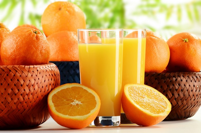 Oranges and orange juice in glasses