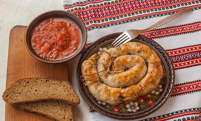 4K Bread, Sausage, and Ketchup on a Cutting Board