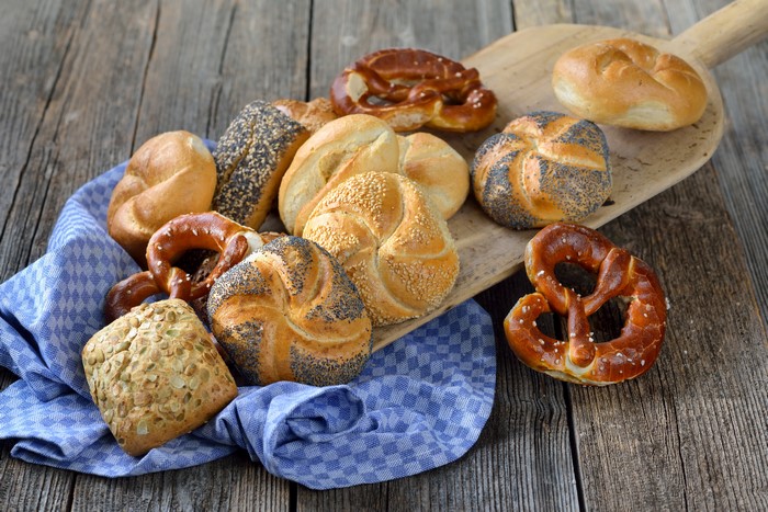 Assortment of Buns and Pretzels on Wooden Surface