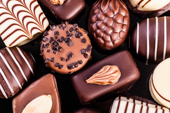 Assortment of gourmet chocolates with intricate designs