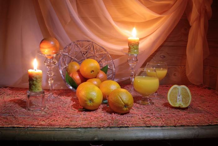 Still-life with oranges and candles