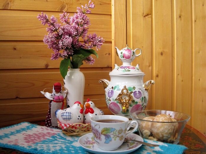 Still life with lilac, tea, and samovar