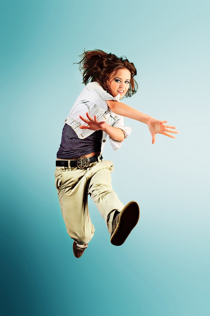 Young woman in casual clothes jumping