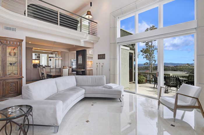 Modern living room with large windows and view
