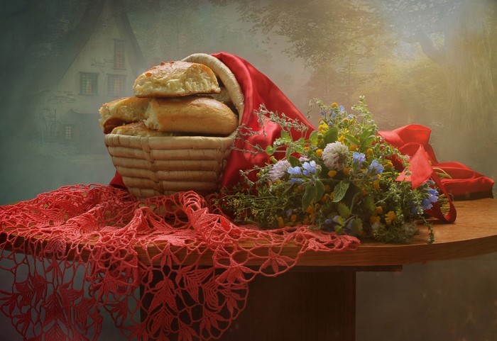 Still-life with buns, bouquet, and red lace