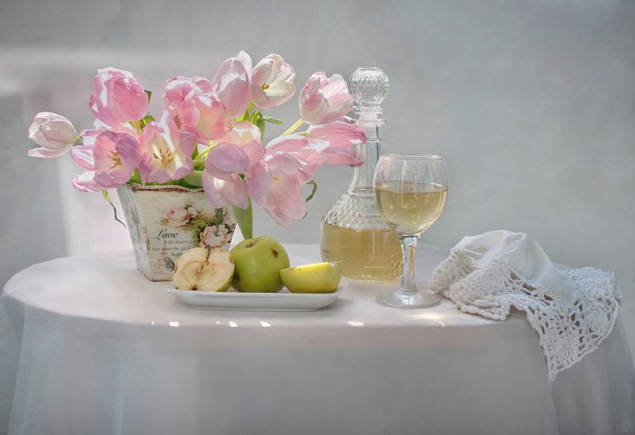 Still-life with pink tulips, wine, and apples