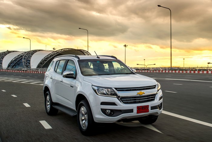 White Chevrolet Trailblazer on a road at sunset