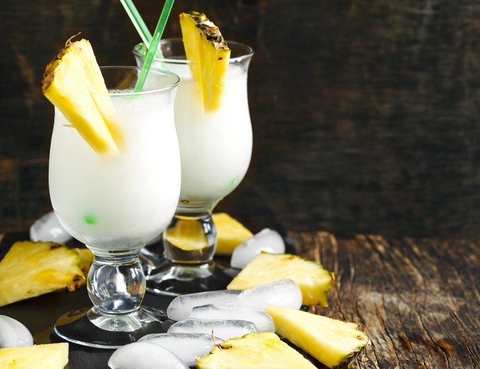 Two Pina Colada Cocktails with Pineapple and Ice