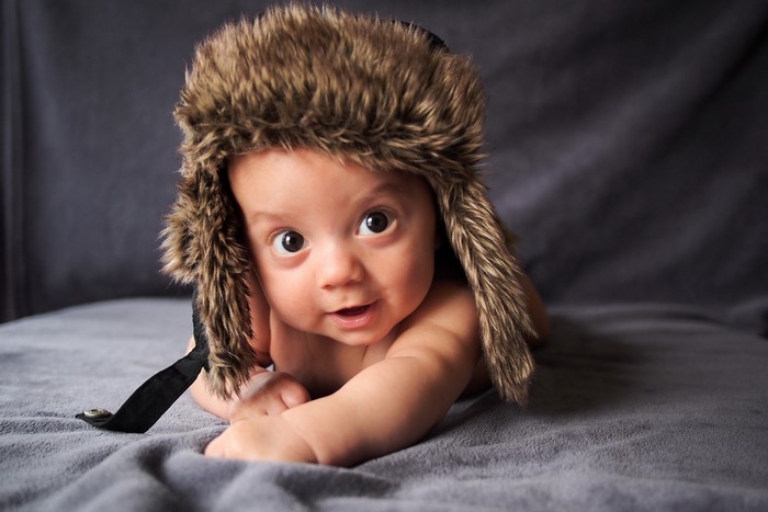 Baby wearing a furry winter hat