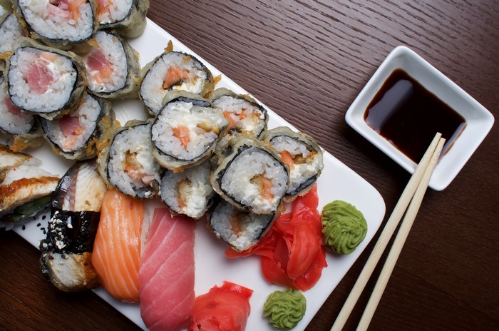 Sushi platter with soy sauce and chopsticks