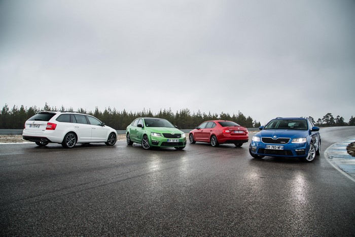 Four Skoda Octavia cars on a wet road
