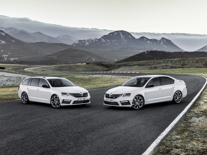 Two white Skoda Octavia cars on a race track