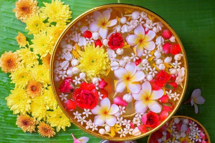 Plumeria and Chrysanthemums in Water Bowl