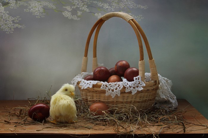 Easter chick and eggs in a wicker basket