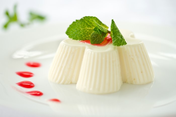 Dessert with mint and red sauce