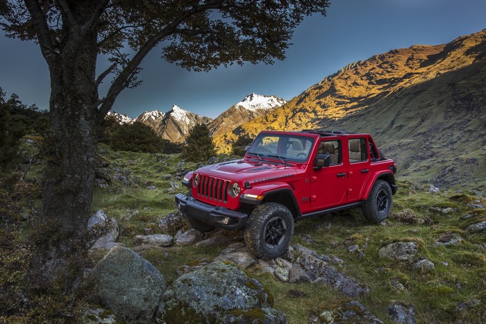 Red Jeep Wrangler Unlimited Rubicon in a Mountainous Landscape