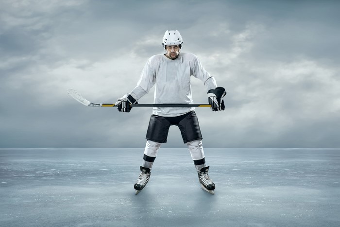 Man in Hockey Uniform on Ice