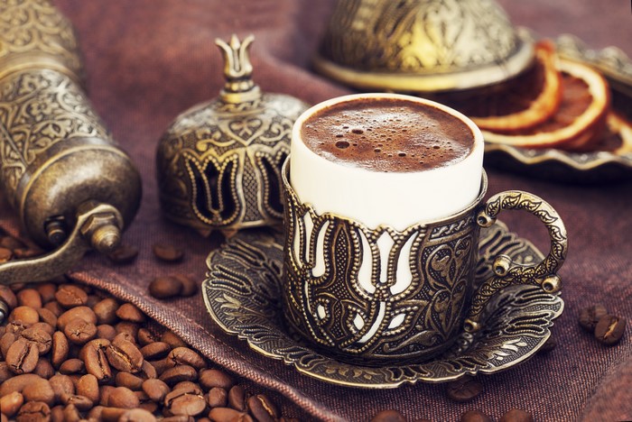 Turkish Coffee Cup with Coffee Beans and Grinder