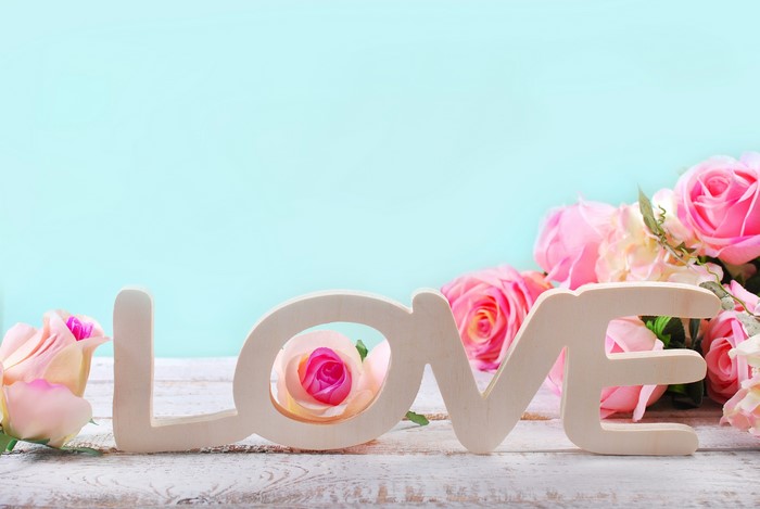 Love word with pink roses