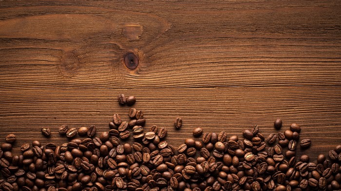 Coffee beans on a wooden surface