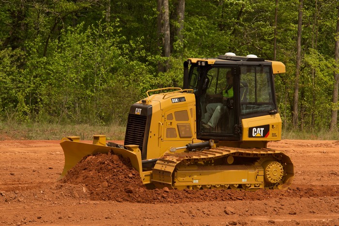 Caterpillar D5K LGP bulldozer working on dirt