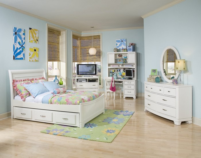 Children's bedroom with white furniture and floral decor
