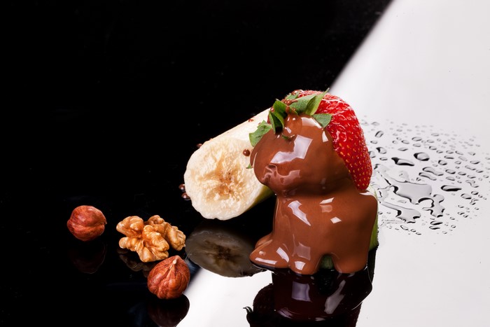 Chocolate-covered strawberry and banana with nuts
