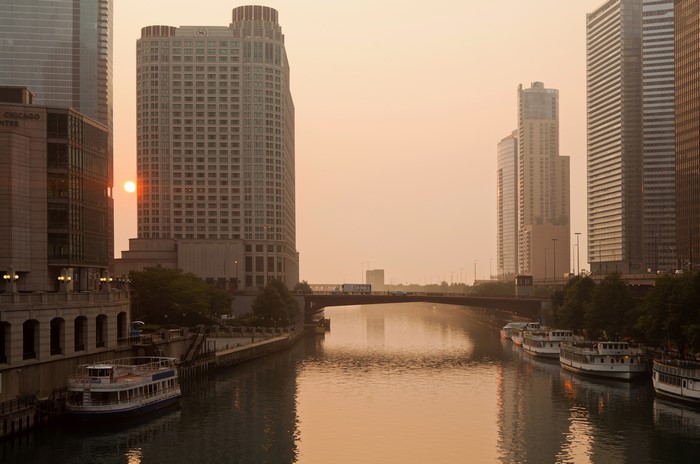 Chicago River at Sunrise with Boats and Buildings