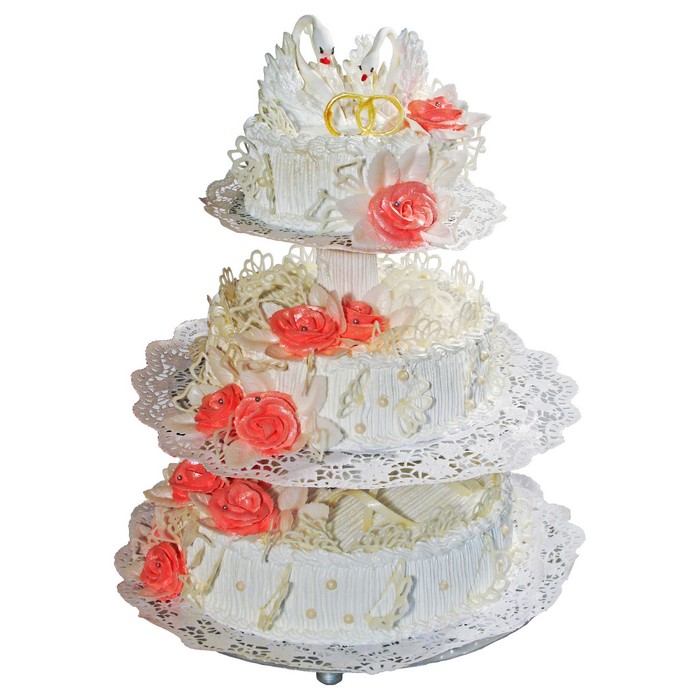 Three-tier wedding cake with swans and roses