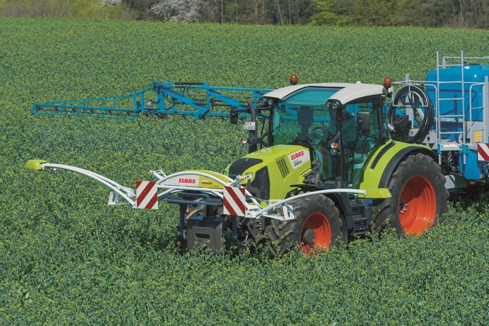 Claas Arion 460 tractor spraying a field
