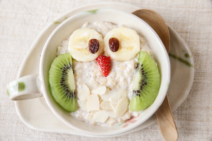 Creative Owl Oatmeal with Kiwi, Banana, and Raisins