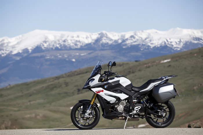 BMW S 1000 XR motorcycle with snowy mountains