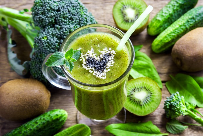 Green smoothie with kiwi, broccoli, cucumber, and mint