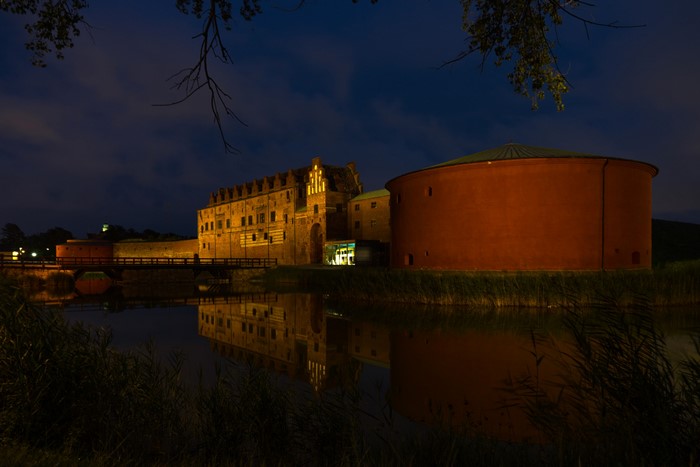 Malmo Castle at night with river and bridge