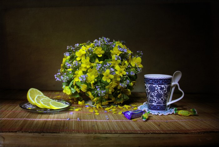 Still life with bouquet, lemons, cup, and candies