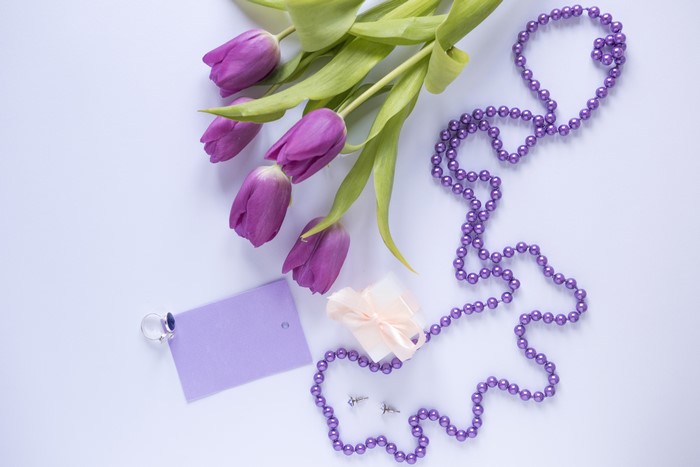 Purple Tulips, Jewelry, Gift, and Ring on Violet Background